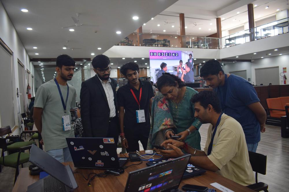 Teams presenting ideas to the jury inside the auditorium
